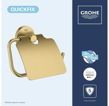 Goudkleurige Grohe toiletrolhouder met klep, QuickFix systeem om te plakken of te schroeven, 5 jaar garantie, Grohe Logo.