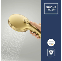 Grohe handdouche goud met waterstraal, omstelknop voor straalsoorten. Logo Grohe, zegel Duits ontwerp en 5 jaar garantie.