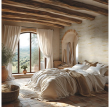Rustieke slaapkamer met houten plafondbalken, muren met textuur, stenen vloer en een groot boogvenster met uitzicht op het landschap.