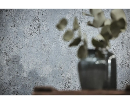 Vliesbehang in betonlook met gestructureerd oppervlak in grijs.