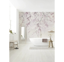 Lichte, moderne badkamer met kersenbloesem fotobehang, een vrijstaand wit ligbad en houten meubels.