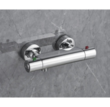 Douchethermostaat in chroom-optiek voor wandmontage met twee draaiknoppen en veiligheidsknoppen.