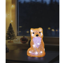 LED-decoratiefiguur vos van acryl met warmwit licht in een kerstsfeer op een tafel voor een raam.