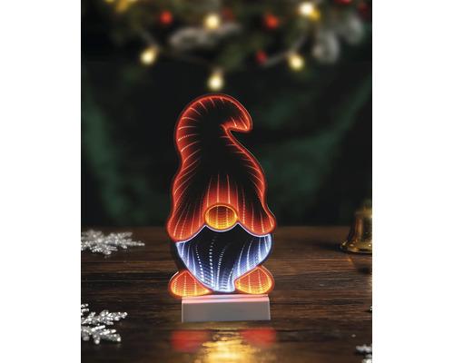 LED-kerstdecoratie met infinity mirror in de vorm van een kabouter met oranje en wit licht op een houten tafel.