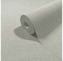 Grijs vliesbehang met textielstructuur in linnenlook, op rol en platliggend.