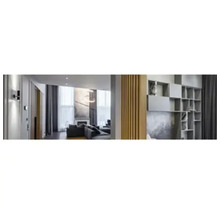 Modern interieur met een woonkamer met grijze hoekbank en een scheidingswand van houten latten naast een inbouwkast.