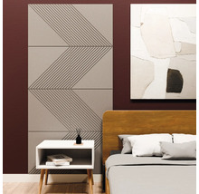 Akoestische panelen met geometrisch zigzagpatroon op een slaapkamermuur naast een bed en nachtkastje.