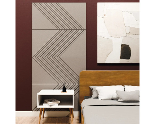 Akoestische panelen met geometrisch zigzagpatroon op een slaapkamermuur naast een bed en nachtkastje.