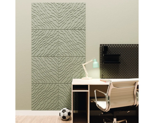 Moderne werkplek met decoratieve 3D akoestische panelen met golfpatroon, bureau, bureaustoel en een zwart gatenbord.