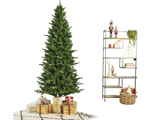 Kunstkerstboom in een modern gedecoreerde kamer met cadeaus en een metalen rek met kerstdecoratie.