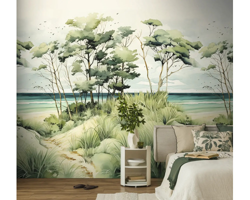 Slaapkamer met een groot fotobehang in aquarelstijl met een kustlandschap met duinen, bomen en de zee.