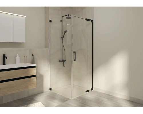 Moderne badkamer met een glazen hoekdouchecabine en zwart beslag naast een wastafelmeubel in houtdecor.