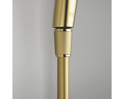 Grohe kraandetail in goudlook met gekartelde aansluiting en Grohe Logo.