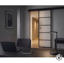 Een werkkamer met een bureau, een LED-bureaulamp en een moderne glazen schuifdeur met een zwart frame. (Image AI modified or generated)