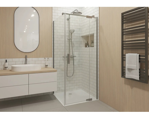 Moderne badkamer met een glazen douchecabine, een wit wastafelmeubel met ovale spiegel en een handdoekradiator tegen een wand met houtlook.