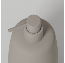 Zeepdispenser met afgerond design en mat oppervlak, close-up van de pomp.