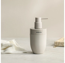 Moderne zeepdispenser met een afgeronde vorm en pompkop, Sealskin Logo.