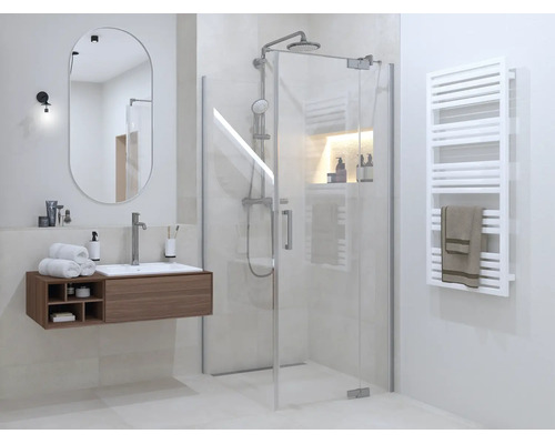 Moderne, lichte badkamer met glazen douchecabine, houten wastafelmeubel, ovale spiegel en een witte handdoekradiator.