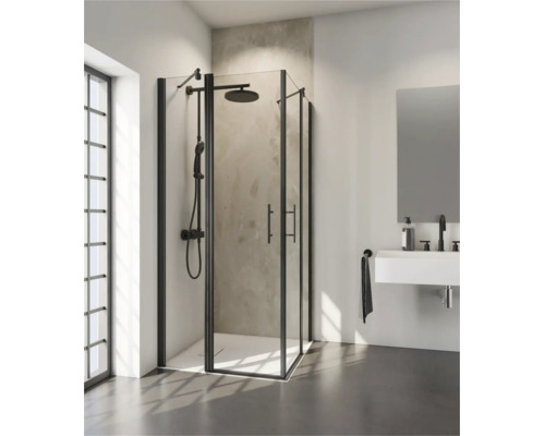 Moderne hoekdouchecabine met zwart frame en douchesysteem in een lichte, eigentijdse badkamer met wastafel en spiegel.