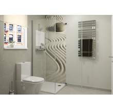 Moderne badkamer met inloopdouche van glas, wandtegel met zen motief, hangtoilet en een handdoekradiator.