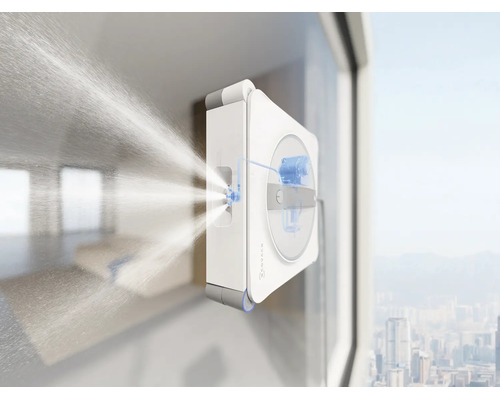 Ecovacs vensterreinigingsrobot tijdens het reinigen van een raam met sproeifunctie