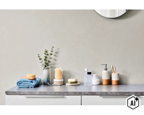 Netjes ingerichte badkamer met wastafel, handdoek, badkameraccessoires, zeepdispenser en tandenborstelbeker op een aanrechtblad. (Image AI modified or generated)