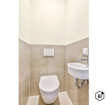 Modern gastentoilet met wandcloset, bedieningspaneel voor inbouwreservoir en kleine wastafel met kraan tegen licht betegelde muren. (Image AI modified or generated)