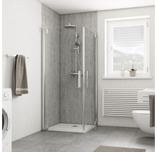 Badkamer met douchecabine, wasmachine, toilet en raam