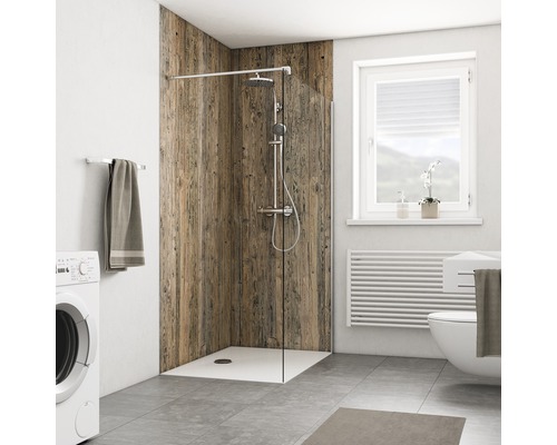 Badkamer met douche, wasmachine, toilet, radiator en raam