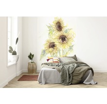 Slaapkamer met muursticker van zonnebloemen boven het bed