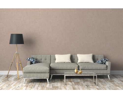 Woonkamer met grijze hoekbank, vloerlamp en salontafel