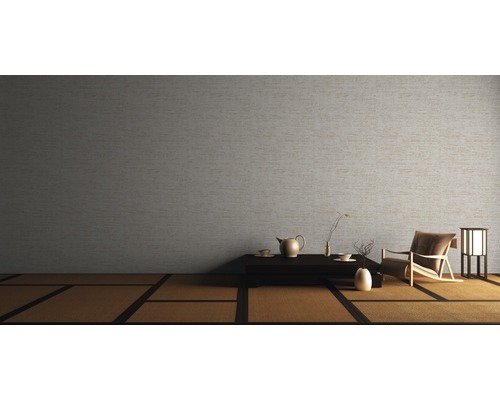 Kamer met Japans geïnspireerd design met tatami-matten, zithoek en eenvoudig wandbehang.