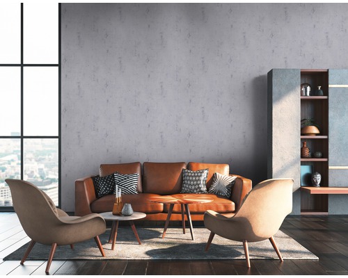 Woonkamer met bank, fauteuils, salontafel en kast