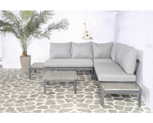 Grijze tuinloungegroep met tafel en sierplant