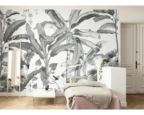 Slaapkamer met tropisch fotobehang, bed en spiegel