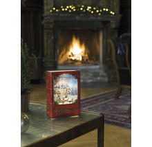 Decoratieve sneeuwbol in boekdesign met kerstmotief voor open haard