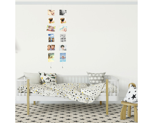 Kinderkamer met fotogalerij, kinderbed en sterrenkleed