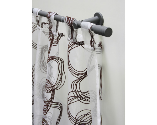 Gordijn met lusbevestiging en abstract patroon op gordijnroede