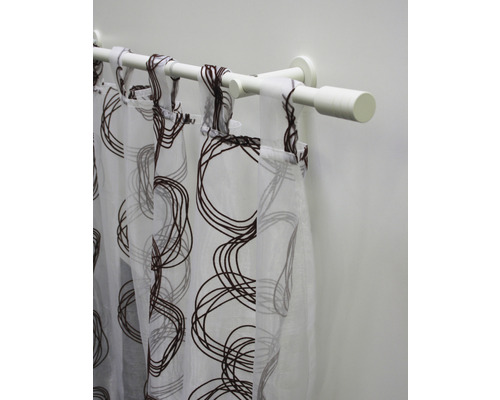 Gordijnroede met een transparant gordijn met cirkelpatroon