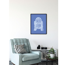 Ingelijste Star Wars wanddecoratie met de tekst Ik ben de droid die je zoekt boven een fauteuil en een plank