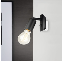 Draaibare wandlamp met lamp gemonteerd op een muur