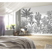 Slaapkamer met jungle behang, bed, stoel en kamerplanten