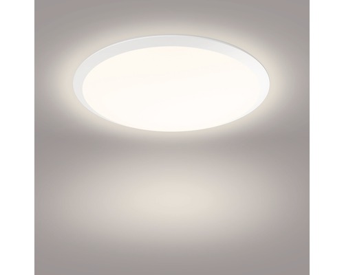 Ronde plafondlamp geeft licht.