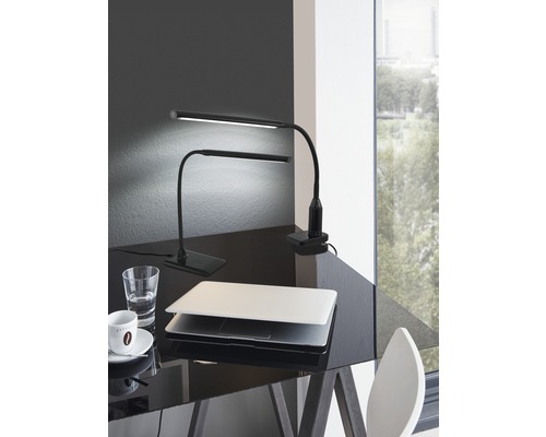 Twee zwarte led-bureaulampen met laptop, glas water en kop koffie op een bureau