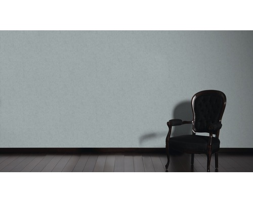 Scene met een fauteuil en een muur