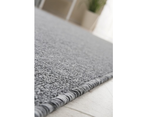 Detailweergave van een grijs tapijt met textuur