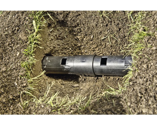 Drainagebuis in de grond met gras