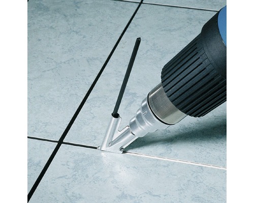 Heteluchtpistool met lasdraad voor het voegen van tegels