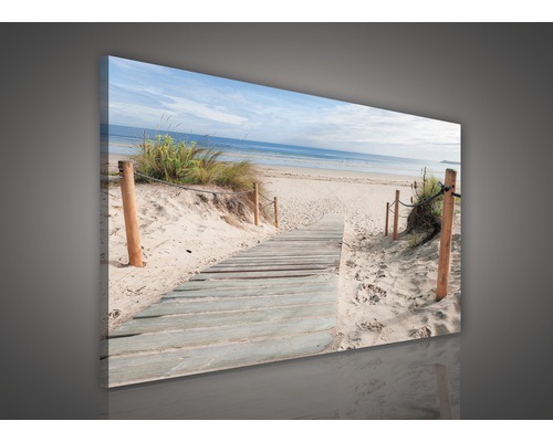 Canvas schilderij met strandmotief, houten loopbrug en uitzicht op zee