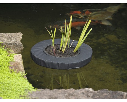 Zwevend planteneiland in vijver met planten